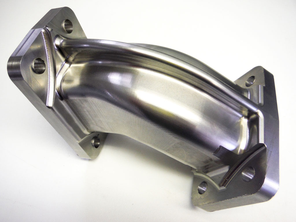 //www.cncmillingcncturning.co.uk/wp-content/uploads/2016/08/90-deg-bend-stainless-steel-elbow-cnc-machined-from-solid.jpg